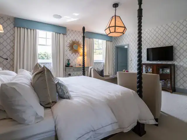 Curtains on automated tracks in a main bedroom